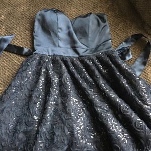 Dark blue, strapless dress.